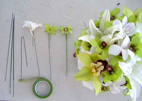 It's not easy to make a round orchid arrangement Each orchid blossom has to